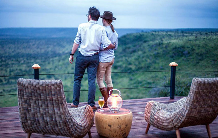 a man and a woman standing on a deck